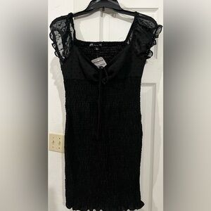 HYFVE body con dress with design sleeves. From coopers closet! NWT
